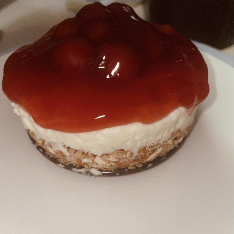 Cheesecake topped with a layer of cherry glaze