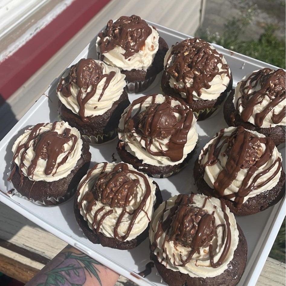 Chocolate cupcake topped with whipped cream